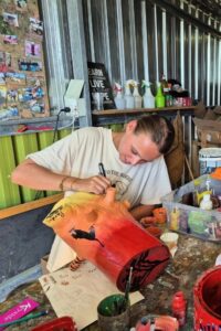 volunteer-painting-big-cat-enrichment-activity